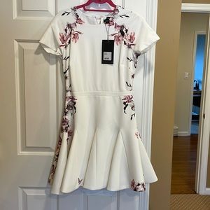 Adorable style stalker white fit and flare dress with purple floral detail